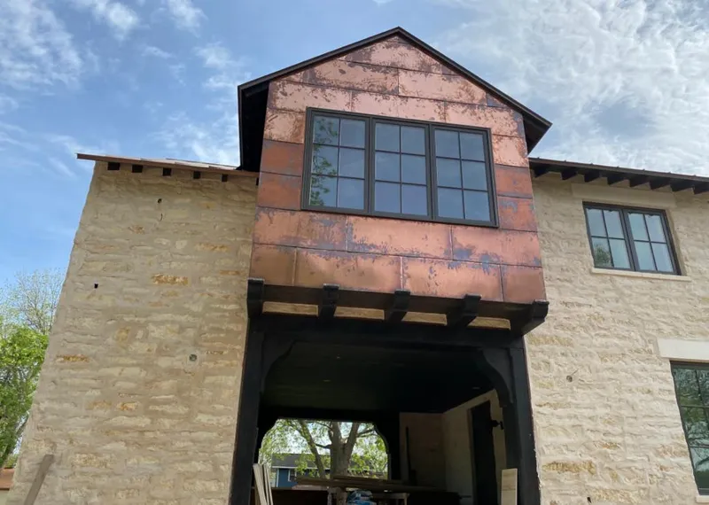 Copper metal panel facade on a stone building for Skylight Installation in Wappingers Falls