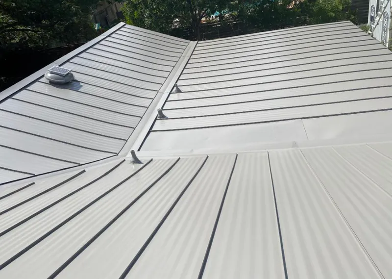 Solar attic fan installed on a metal roof for Roof Ventilation in Wappingers Falls